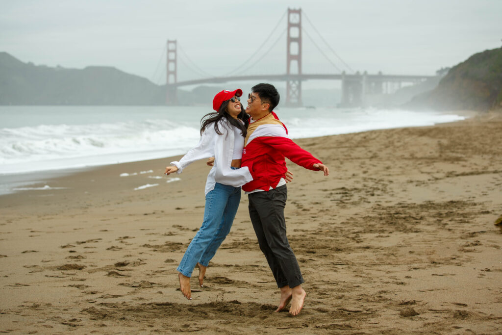 Celebrating 49ers Engagement photo session at Baker Beach in San Francisco, California