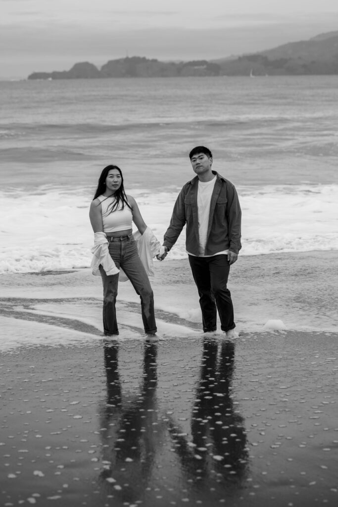Couple holding hands during engagement session in San Francisco California