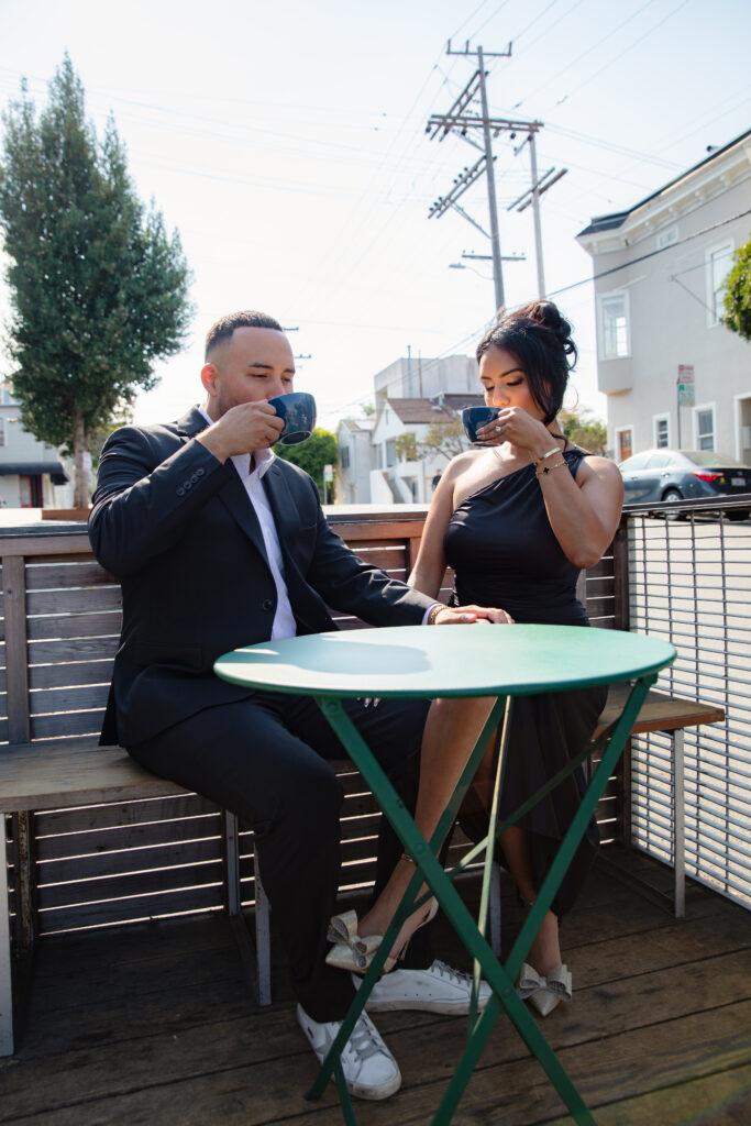 Engaged couple shares a latte in San Francisco.