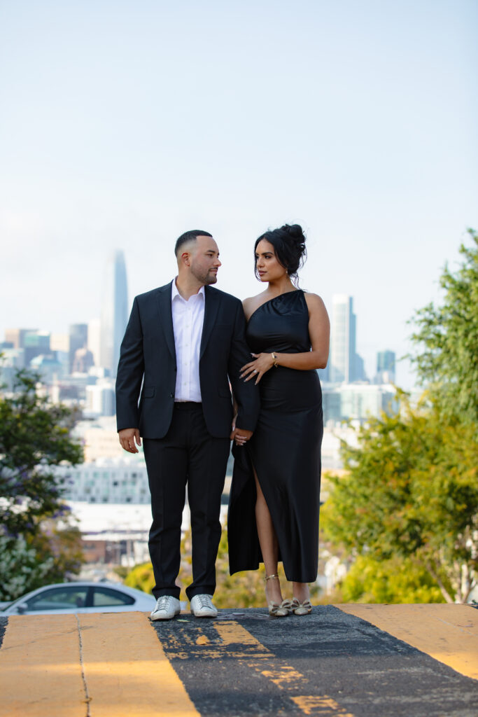 Couple standing in crosswalk in San Francisco. 